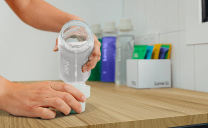 Pouring the Sensitive Laundry Liquid into Measuring Cup
